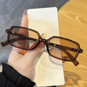 Detail of vintage square semi-transparent brown sunglasses with gradient lenses