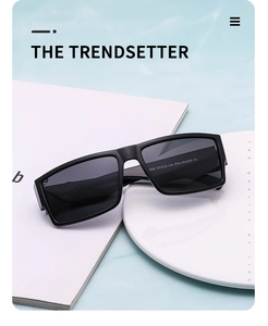 Detail view showing polarized label and model 7302 specs on black sunglasses temples