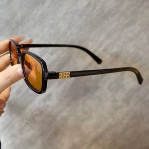Retro square sunglasses with orange lenses and gold rockstud pyramid rivet temple detail