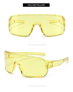 Detail view of yellow oversized cycling sunglasses with windproof shield frame and nose pads