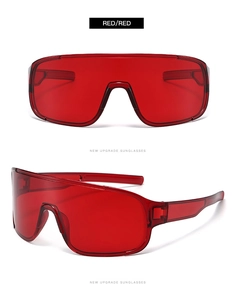 Detail view of red shield sunglasses with transparent PC lenses and matching red frame