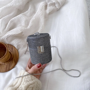 Mini silver sequin cylinder crossbody bag with elegant chain strap and metal lock