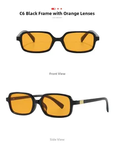 Detail view of vintage black square sunglasses with vibrant orange lenses and metal hinges