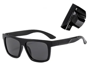 Detailed macro view of the sturdy metal hinge and temples of black polarized sunglasses