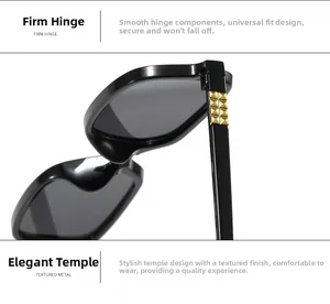Detail of square sunglasses with black frame, firm hinge, and gold metal accents