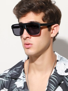 Male model wearing black oversized polarized sunglasses with retro street fashion style