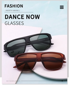 Close-up of polarized pilot sunglasses with black and brown frames on water rippled background