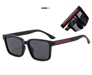 Detail view of square black sunglasses showing the stylish red stripe on the temple