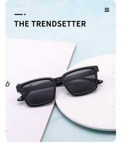 Top view of black rectangular polarized sunglasses on a modern blue and white display