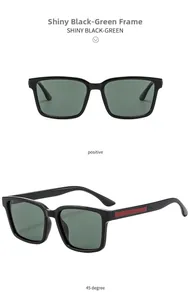 Detail view of black square sunglasses with G15 green lenses and red temple accents