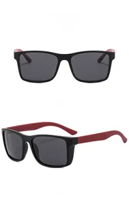 Front and 45-degree angle views of black and red sports sunglasses with textured temples