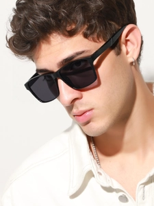 Close-up of black rectangular sports sunglasses with dark polarized lenses on model