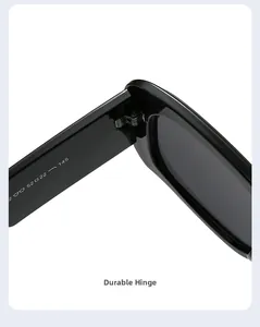 Close-up of durable metal hinge and size specifications on black sunglasses temple
