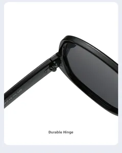 Macro view of the sturdy metal hinge connecting black frame and temple of sunglasses