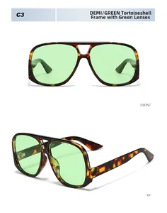 Detail view of large pilot-style sunglasses with demi frame and green lenses