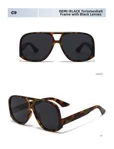 Detail view showing tortoise frame and black gray lenses of vintage oversized sunglasses