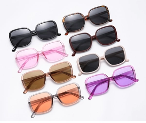 Close-up of retro oversized square sunglasses in various colors and tinted lenses