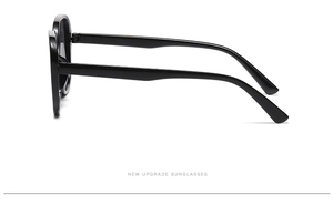Close-up side view of retro oversized square sunglasses with thick black frames