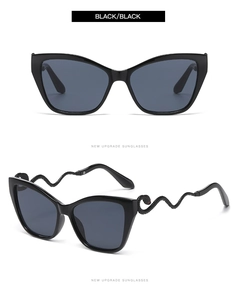 Macro view of cat eye sunglasses with metal snake temples and polished black frames