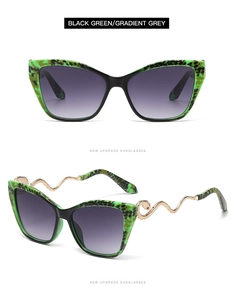 Macro detail of cat-eye sunglasses featuring snake-shaped metal temples and green pattern