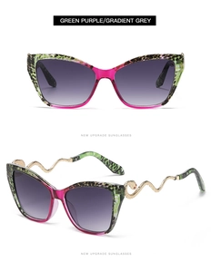 Detail of snake-shaped gold metal temples on green purple cat-eye sunglasses