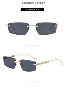 Detail of rimless sunglasses featuring golden pyramid studded temples and dark lenses