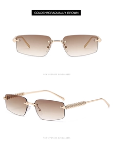 Detail view of small rimless sunglasses with gold metal frame and gradient brown lenses