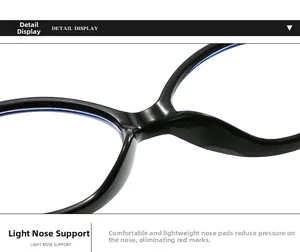 Detailed macro view of the integrated nose pad on shiny black oval eyeglass frames
