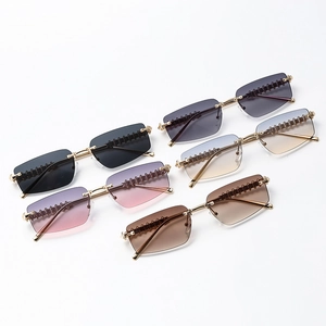 Modern rimless polygonal sunglasses set with gradient lenses and textured metal temples