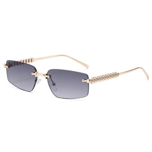 Frameless polygonal sunglasses with grey gradient lenses and gold punk scale metal temples