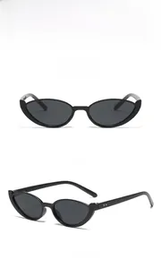 Detail view of vintage cat-eye sunglasses with black frames and UV400 lenses