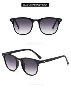 Détail de lunettes de soleil noires avec rivets argentés et verres gris dégradés