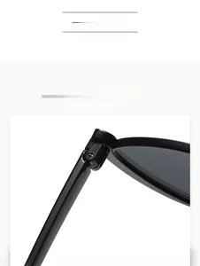 Close-up of a strong hinge design with silver screw on black vintage sunglasses