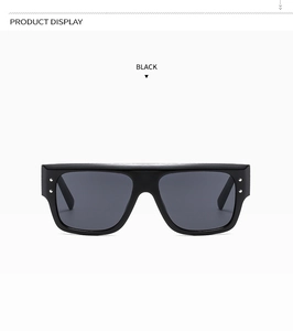 Front view of black oversized square sunglasses with stylish metal rivet details on the frame