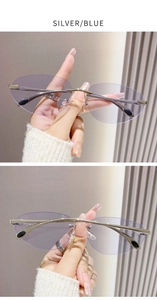 Détail de lunettes de soleil ovales sans monture en métal argenté aux verres bleu clair