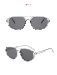 Détail de lunettes aviateur transparentes à double pont avec verres gris foncé
