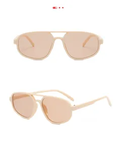Détails de lunettes aviateur rétro avec monture crème et verres orange clair