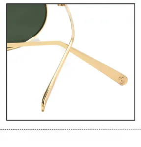 Detail of golden metal sunglasses temples with floral logo and ergonomic curved design