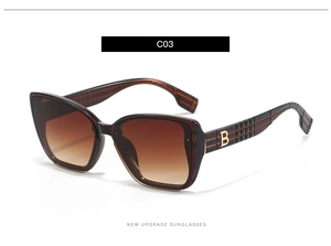 Detail of square oversized sunglasses showing brown frame with gold B logo and check pattern