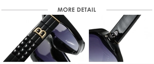 Macro view of purple gradient lens with gold B logo on textured black sunglasses temple