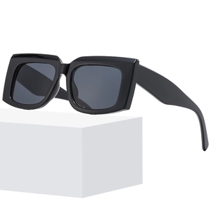 Vintage rectangle sunglasses with thick black frames and dark grey UV lenses for street style