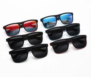 Flat lay of polarized sport sunglasses in matte black frames with blue and orange lenses