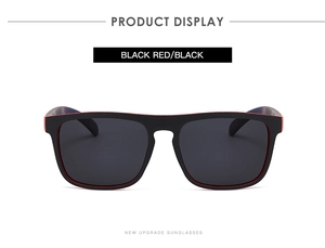 Detail view of square black and red polarized sport sunglasses with grey lenses