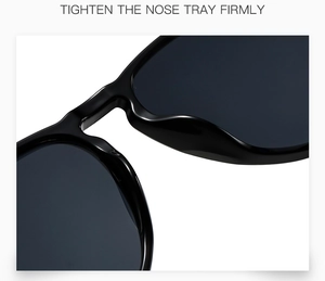 Macro view of tight nose tray and bridge detail on polished black oversized sunglasses