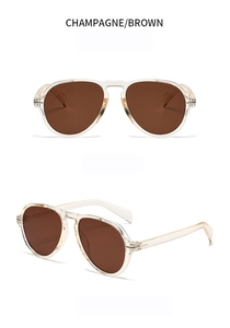 Detail view of champagne aviator sunglasses with brown lenses and double bridge design