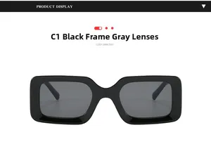 Detail of trendy rectangle black frame sunglasses with grey lenses in a retro style