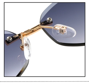 Detailed close-up of golden metal bridge and soft silicone nose pads on sunglasses