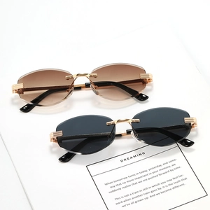 Retro round rimless sunglasses with leopard head metal frame in tea and gray lenses