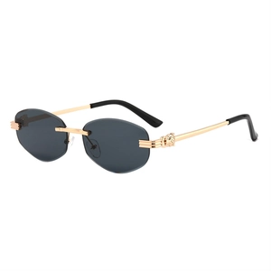 Modern rimless sunglasses with grey lenses and gold leopard head detail on the metal arms