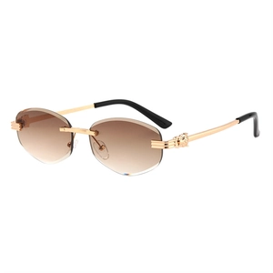 Fashion rimless sunglasses with gradient brown lenses and golden leopard head decor
